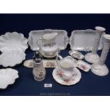 Three white Coalport wavy edged dishes, a pair of white candlesticks,