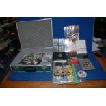 A metal case of 'The Beatles' ephemera to include; music, DVD's, badges, photos, etc.
