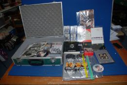 A metal case of 'The Beatles' ephemera to include; music, DVD's, badges, photos, etc.