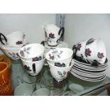 A Royal Albert ''Masquerade'' part Teaset comprising cake plate, twelve side plates, six cups,