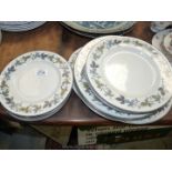 A good quantity of Royal Doulton Burgundy plates including dinner,