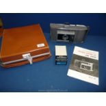 A leather cased Polaroid Electric Eye Land camera, model J66.