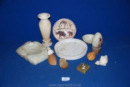 A quantity of onyx items including large ashtray, two small eggs, vase,