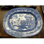 A small blue and white Willow pattern Plate