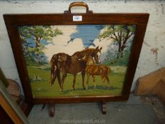 A Fire screen with tapestry depicting mare and foal,