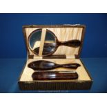 A boxed tortoise shell Brush and mirror set **
