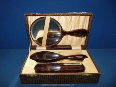 A boxed tortoise shell Brush and mirror set **