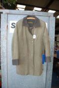 A 'Marcona' three quarter length green Overcoat with dark green collar and turned up sleeves,