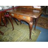 A Georgian Oak Side Table having a frieze drawer with pierced backplate drop handles and standing