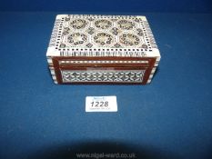 A small lacquered Box with black & white and mother of pearl detail,