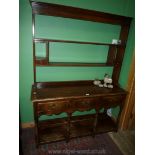 A contemporary Oak potboard Welsh Dresser having three frieze drawers,