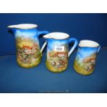 Three graduated Sylvac jugs with Old Country scenes