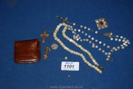 A quantity of rosary beads, mother of pearl beads, leather rosary pouch, pewter brooch, etc.