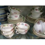A Samuel Radford Ltd floral green & gilt part tea set to include; twelve cups, twelve saucers,