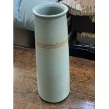 A stylish tapering cylinder shaped blue tall Stoneware Vase with speckled finish and a glaze-resist