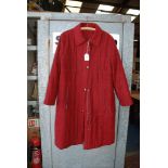 A 'Kirsten' burgundy long zip up Coat, size 12.