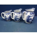 A graduated set of of blue and white Royal Doulton Jugs,