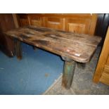 An old Pine Pig Bench having substantial chamfered, rectangular section legs,