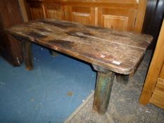An old Pine Pig Bench having substantial chamfered, rectangular section legs,