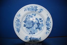 A good English Delftware charger painted with flowers; mid 18th century;