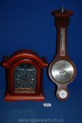 A Bentima battery clock and a Comitti of London Barometer.