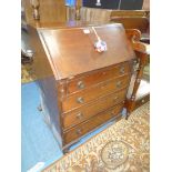 A compact mahogany Bureau,