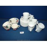 A quantity of coffee cups and saucers,