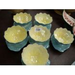 A set of six Royal Winton Grimwades Lustreware Lotus sundae bowls in pale blue and yellow,