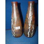 A pair of Art Glass vases signed Leune, enamelled with birch trees beside a lake (one repaired),