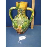 An antique Turkish Canakkale two handled red earthenware Vase decorated in yellow and green,