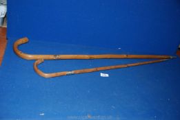 Two miscellaneous wooden hiking sticks