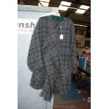 A two tone grey long Coat with button front and scarf made in Ireland.