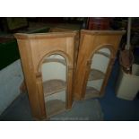 A pair of antique Pine architectural niches having carved friezes and arch detail and well formed