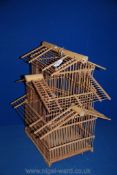 A bamboo bird cage, 50 cm high x 39 cm wide.