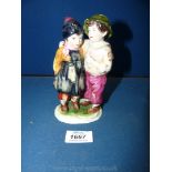 A continental porcelain figure of boy and girl, Crown and K or R marking underneath.