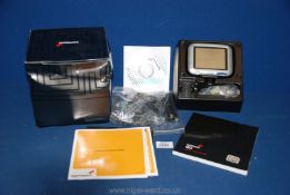 A boxed TomTom with instructions, leads etc.