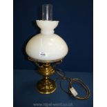 An Oil lamp converted to electric with white shade, 19 3/4'' tall overall approx.
