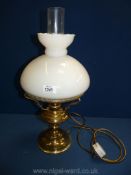 An Oil lamp converted to electric with white shade, 19 3/4'' tall overall approx.