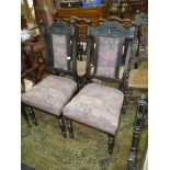 A pair of probably Edwardian dark stained hardwood framed Dining/side Chairs having turned front