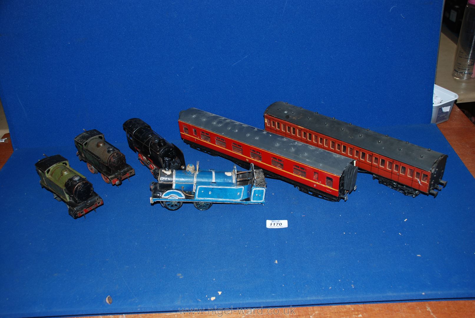 A quantity of 'O' gauge railway coaches including wooden bogie coach,