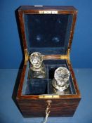 A Coromandel Decanter Box with brass corners and brass inset carrying handles,