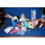 A box of Sindy accessories to include; a horse, scooter, settee, etc.