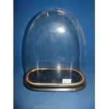 A glass Dome with base. 14" tall including base and 12" wide overall, ideal for clock.