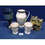 Three pieces of Moray pottery, owl money box and Celtic pottery vase.