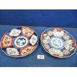 Two oriental Plates in shades of blue and orange, 8 1/2'' diameter,