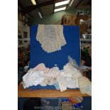 A quantity of vintage baby knitted clothes, crocheted shawl, etc.