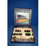 A vintage 1950's Hornby clockwork tinplate passenger set in original box, with key and rails.