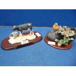 Two Border Fine Arts figures - Robin with chicks in Boot (RB45) and Calf with upturned bucket of