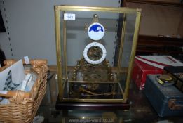A heavy Brass Skeleton Clock having 3 3/4'' diameter enamelled chapter ring with Arabic numerals