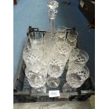 A quantity of cut glass including wine, sherry and whisky glasses and decanter with stopper.